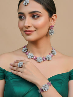 Woman wearing the Rosemont ruby pink five-piece jewellery combo set