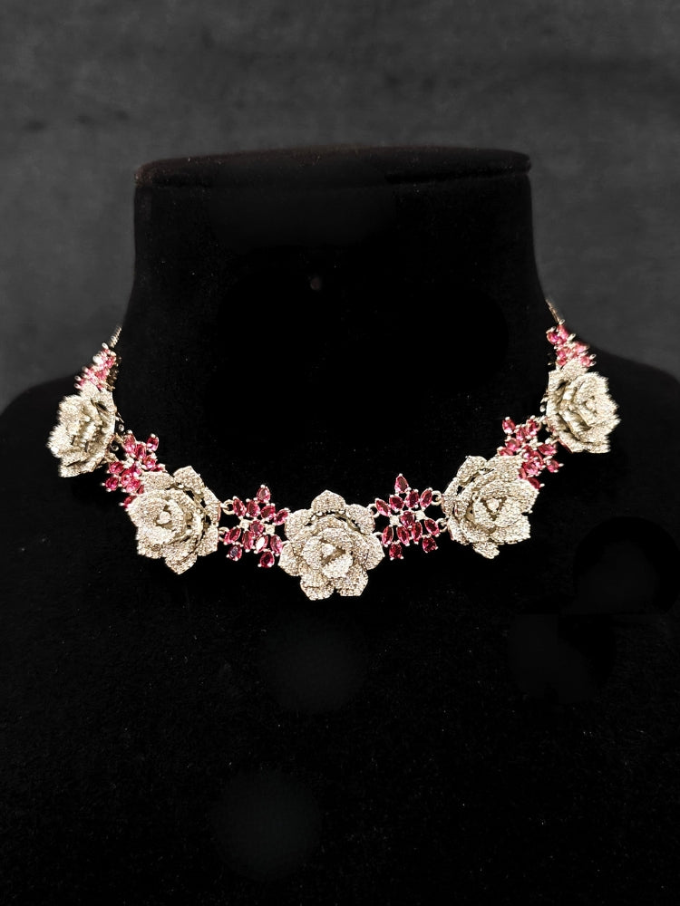 Close-up of an ornate Indo-western Pink Silver Collar American Diamond jewellery set, earrings, maangtikka, Ring and Bracelet with Pink Colored Stones and American Diamond. A graceful trending American diamond necklace for a 2026 wedding celebration.
