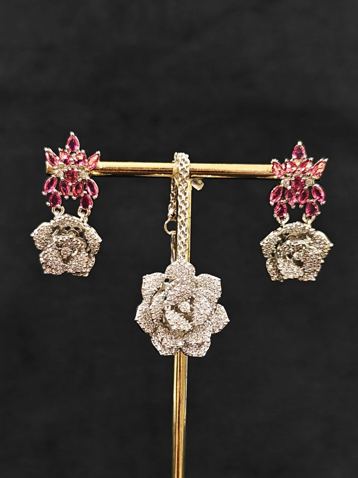Close-up of an ornate Indo-western Pink Silver Collar American Diamond jewellery set, earrings, maangtikka, Ring and Bracelet with Pink Colored Stones and American Diamond. A graceful trending American diamond necklace for a 2026 wedding celebration.