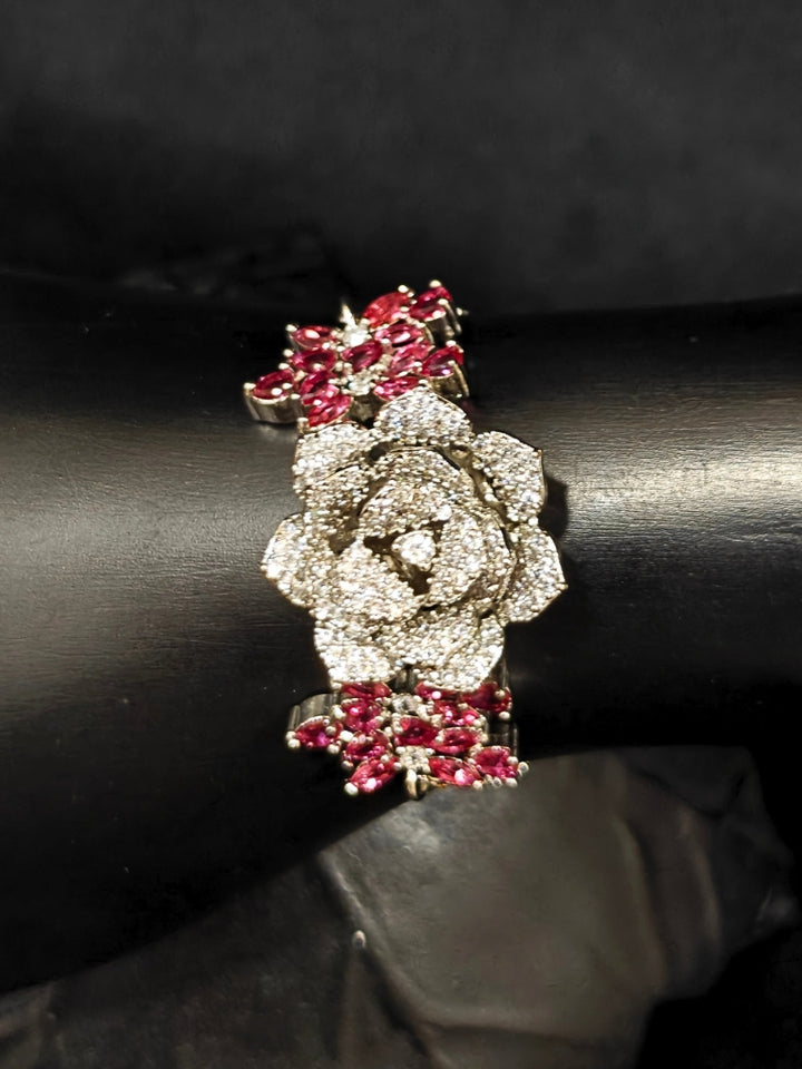 Close-up of an ornate Indo-western Pink Silver Collar American Diamond jewellery set, earrings, maangtikka, Ring and Bracelet with Pink Colored Stones and American Diamond. A graceful trending American diamond necklace for a 2026 wedding celebration.