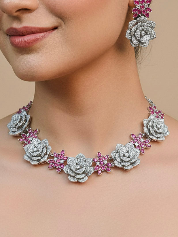 Close-up of a woman wearing an ornate  Indo-western Pink Silver Collar American Diamond jewellery set, earrings, maangtikka, Ring and Bracelet with Pink Colored Stones and American Diamond. Woman styling a statement American diamond necklace with an off-shoulder gown for a reception. A graceful woman wearing a trending American diamond necklace for a 2026 wedding celebration.