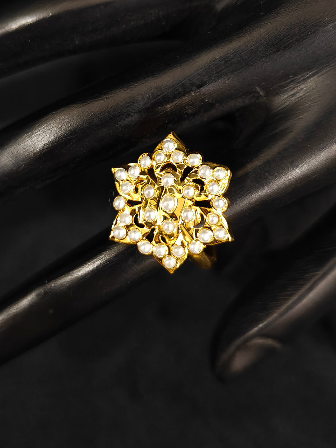 Close-up of an ornate traditional White jadau gold Bracelet with matched Ring with pearls. Festive outfit paired with a premium imitation Jadau bracelet with Ring in India. Close-up of a high-quality imitation Jadau bracelet with Ring for festive wear.