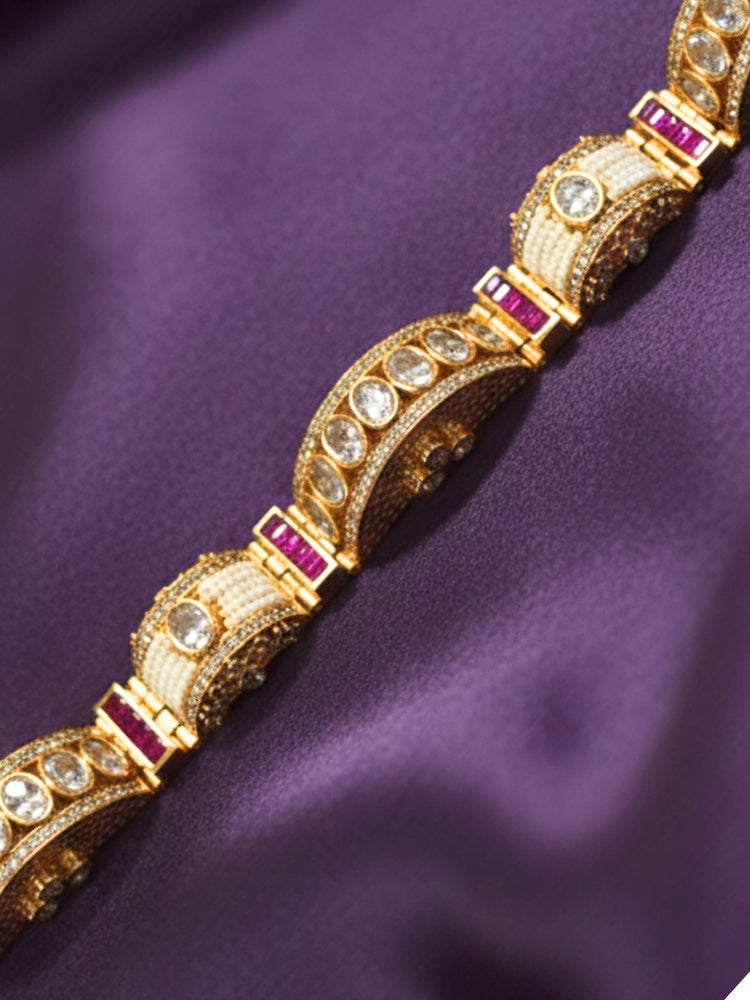 Close-up of an ornate Traditional American Diamond Bracelet with Gold Polish, American Diamond, Colored Stones, Pearls and Filigree Work. Festive outfit paired with a premium imitation American Diamond bracelet in India. Close-up of a high-quality imitation bracelet for festive wear.