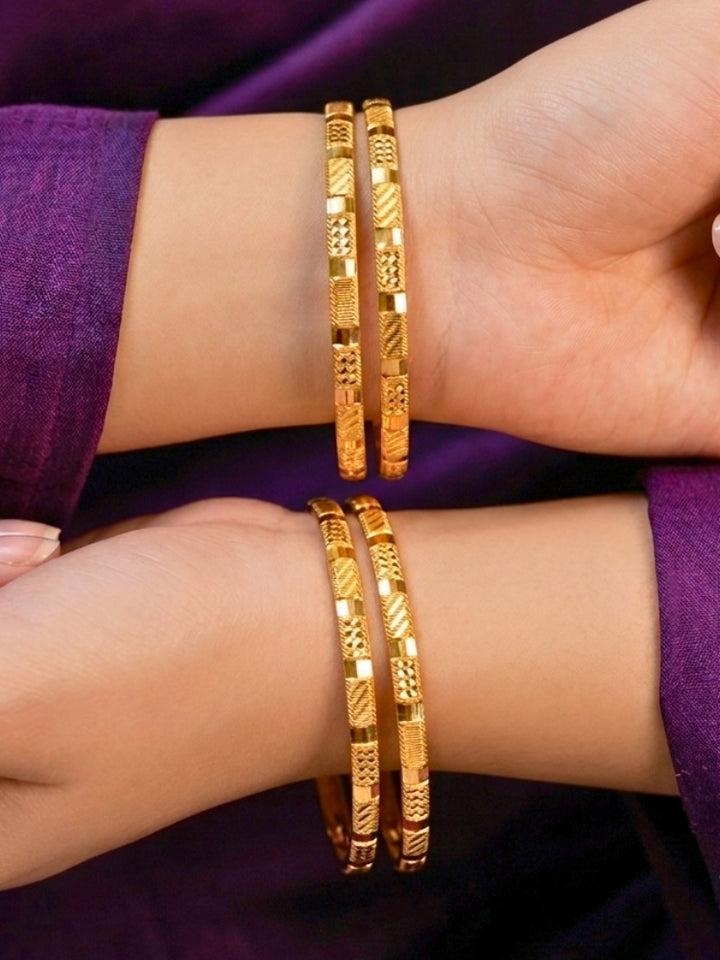 Close-up of an a women wearing ornate traditional (Gold Polish) Bangles Set. It’s comfortable and lightweight enough for everyday wear, and it also looks absolutely beautiful and elegant. The design is stylish, the finish is impressive, and it feels really pleasant to wear all day.