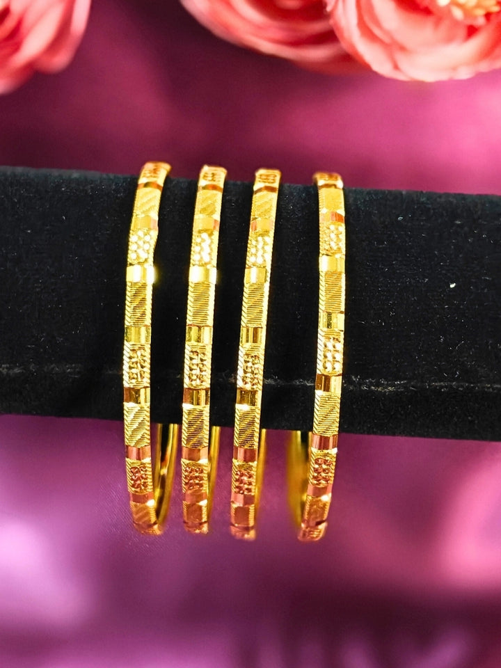 Close-up of an ornate traditional (Gold Polish) Bangles Set. It’s comfortable and lightweight enough for everyday wear, and it also looks absolutely beautiful and elegant. The design is stylish, the finish is impressive, and it feels really pleasant to wear all day.