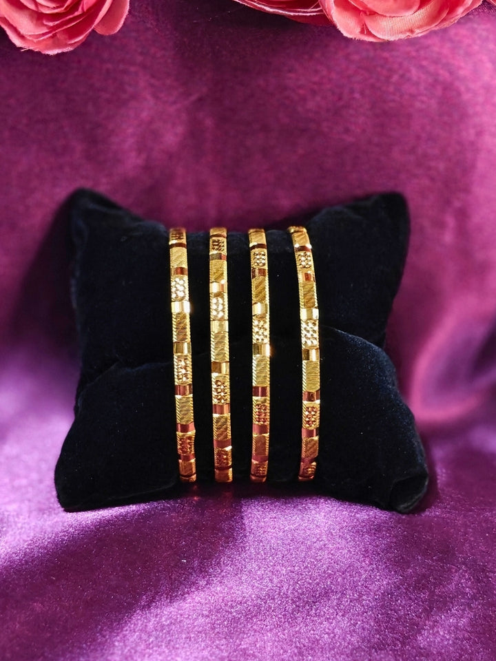 Close-up of an ornate traditional (Gold Polish) Bangles Set. It’s comfortable and lightweight enough for everyday wear, and it also looks absolutely beautiful and elegant. The design is stylish, the finish is impressive, and it feels really pleasant to wear all day.