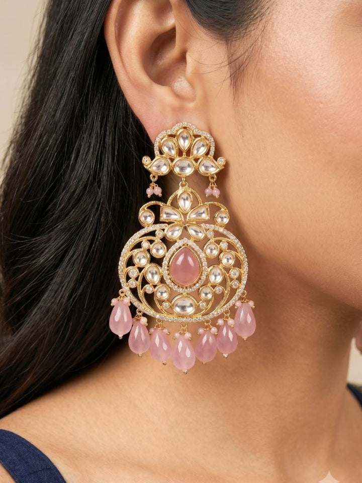 Close-up of a woman wearing an ornate traditional (Gold Polish) Mint Pink Long jewellery set and earrings with Polki, American Diamond, Pearls, Crystal Beads and Tumble Beads. Wedding guest wearing a statement Polki artificial necklace for a reception party. Festive celebration look completed with premium imitation Polki jewelry.