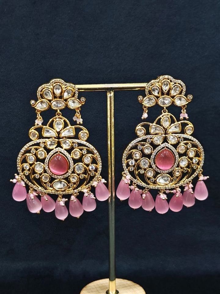 Close-up of an ornate traditional (Gold Polish) Mint Pink Long jewellery set and earrings with Polki, American Diamond, Pearls, Crystal Beads and Tumble Beads. Wedding guest wearing a statement Polki artificial necklace for a reception party. Festive celebration look completed with premium imitation Polki jewelry.