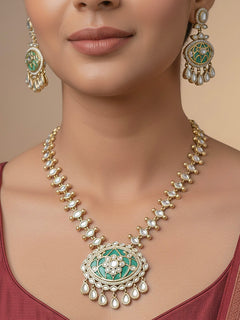 Close-up of a woman wearing an ornate traditional (Mehendi Polish Antique Finish) Sea Green Collar jewellery set and earrings with Kundan, Monalisa Stone, Colored Stones and American Diamond. Woman wearing trending Kundan artificial jewelry for wedding season in India. Festive Diwali outfit paired with a premium Kundan jewelry piece.