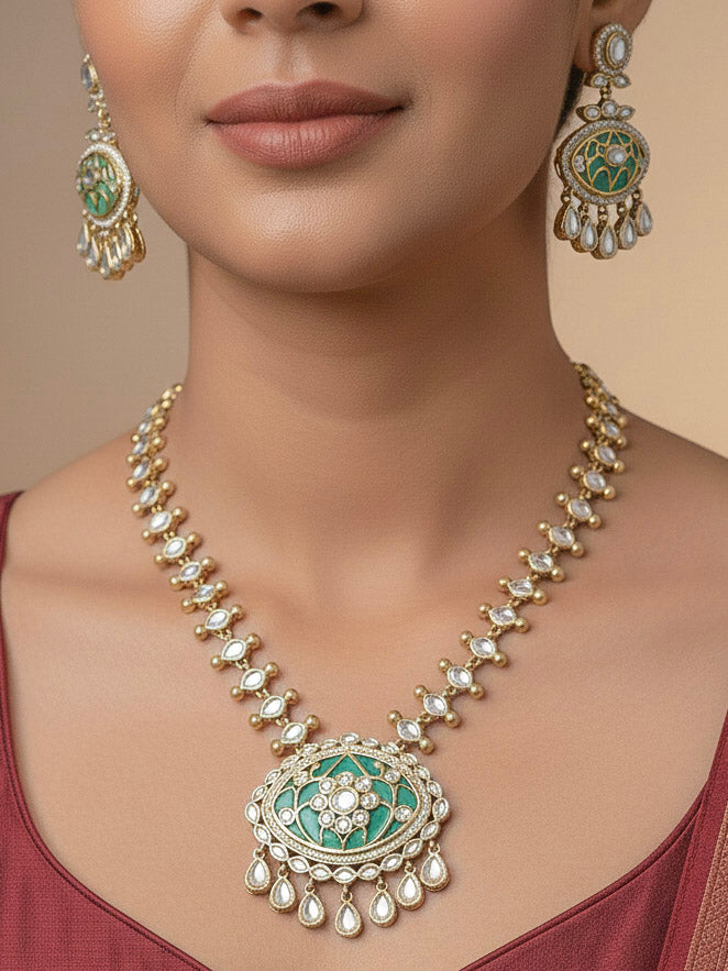 Close-up of a woman wearing an ornate traditional (Mehendi Polish Antique Finish) Sea Green Collar jewellery set and earrings with Kundan, Monalisa Stone, Colored Stones and American Diamond. Woman wearing trending Kundan artificial jewelry for wedding season in India. Festive Diwali outfit paired with a premium Kundan jewelry piece.
