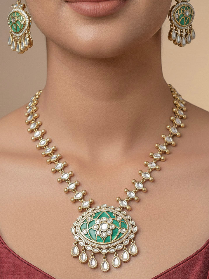 Close-up of a woman wearing an ornate traditional (Mehendi Polish Antique Finish) Sea Green Collar jewellery set and earrings with Kundan, Monalisa Stone, Colored Stones and American Diamond. Woman wearing trending Kundan artificial jewelry for wedding season in India. Festive Diwali outfit paired with a premium Kundan jewelry piece.