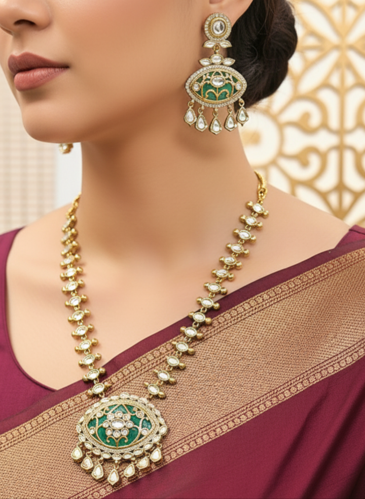 Close-up of a woman wearing an ornate traditional (Mehendi Polish Antique Finish) Sea Green Collar jewellery set and earrings with Kundan, Monalisa Stone, Colored Stones and American Diamond. Woman wearing trending Kundan artificial jewelry for wedding season in India. Festive Diwali outfit paired with a premium Kundan jewelry piece.