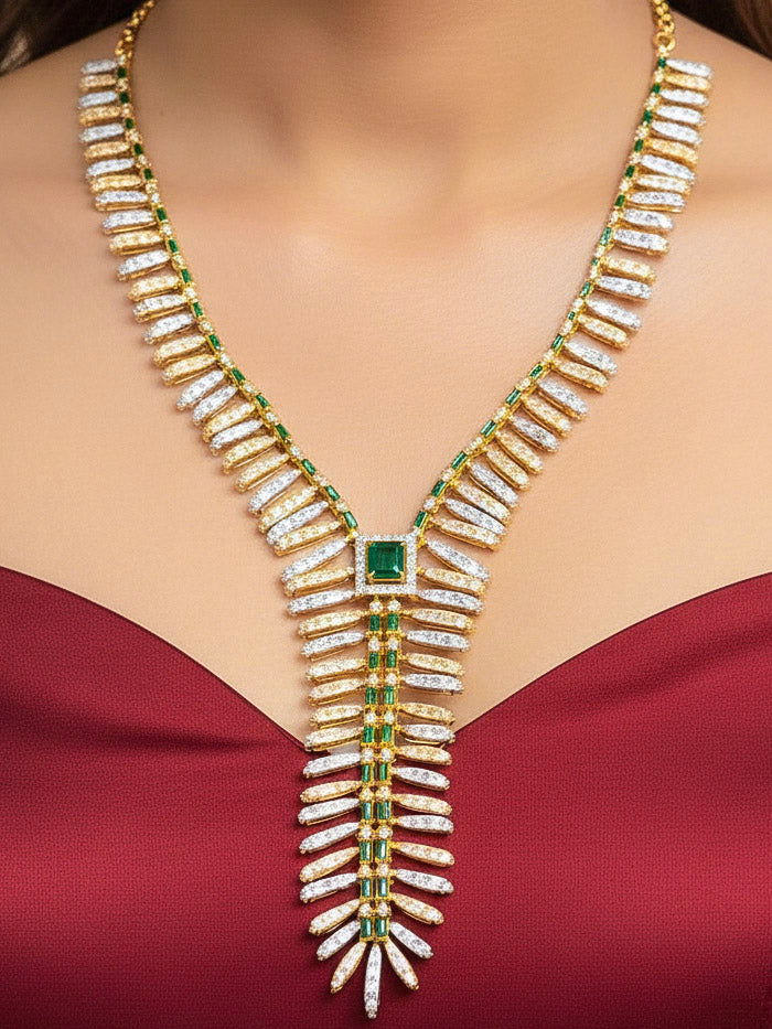 Close-up of a woman wearing an ornate Indo-western gold jewellery set and earrings with American Diamonds and Green Colored Stones. Close-up of a cocktail party look featuring a premium American diamond necklace. Bride-to-be styled in a premium American diamond artificial necklace for her reception party.
