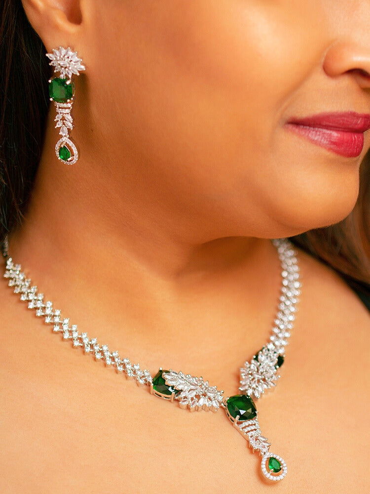Close-up of a woman wearing a stunning affordable artificial diamond necklace and matching earrings set, perfect for wedding guests and formal events. This luxury artificial diamond jewelry provides the brilliance of real diamonds at a fraction of the cost.