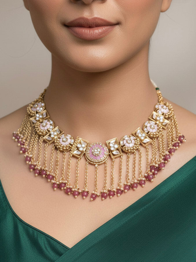 Close-up of a woman wearing an ornate traditional Mint Pink Heritage gold Collar jewellery set and earrings and maangtikka with Beads, Colored Stones and Kundan. Woman wearing a heritage-inspired artificial necklace for wedding festivities. Saree styling inspiration with a traditional heritage necklace.