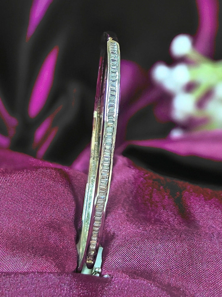 Close-up of an ornate Western (Silver Polish) Bracelet with American Diamond. Festive outfit paired with a premium imitation American Diamond bracelet in India. Close-up of skin-friendly artificial jewelry American Diamond bracelet in India.