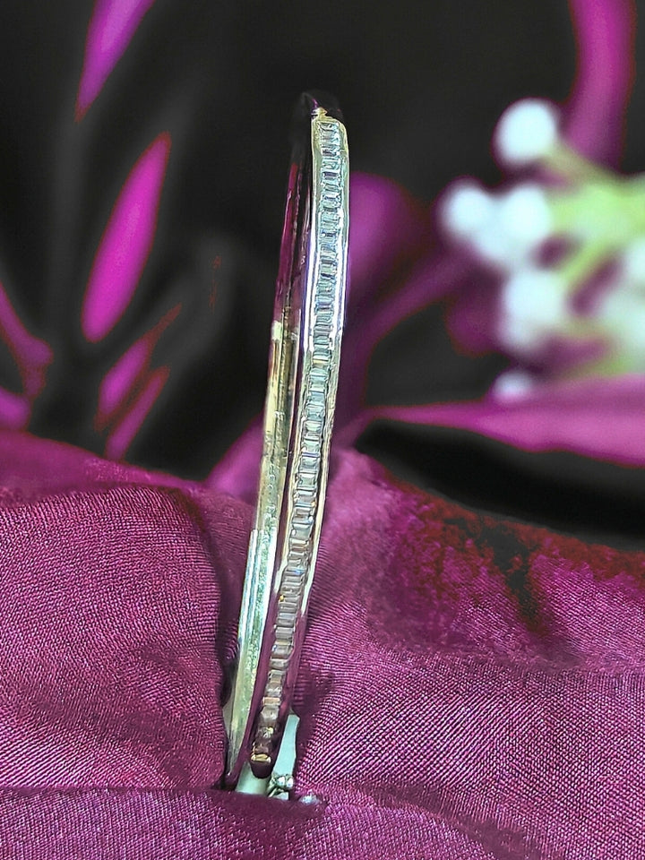 Close-up of an ornate Western (Silver Polish) Bracelet with American Diamond. Festive outfit paired with a premium imitation American Diamond bracelet in India. Close-up of skin-friendly artificial jewelry American Diamond bracelet in India.