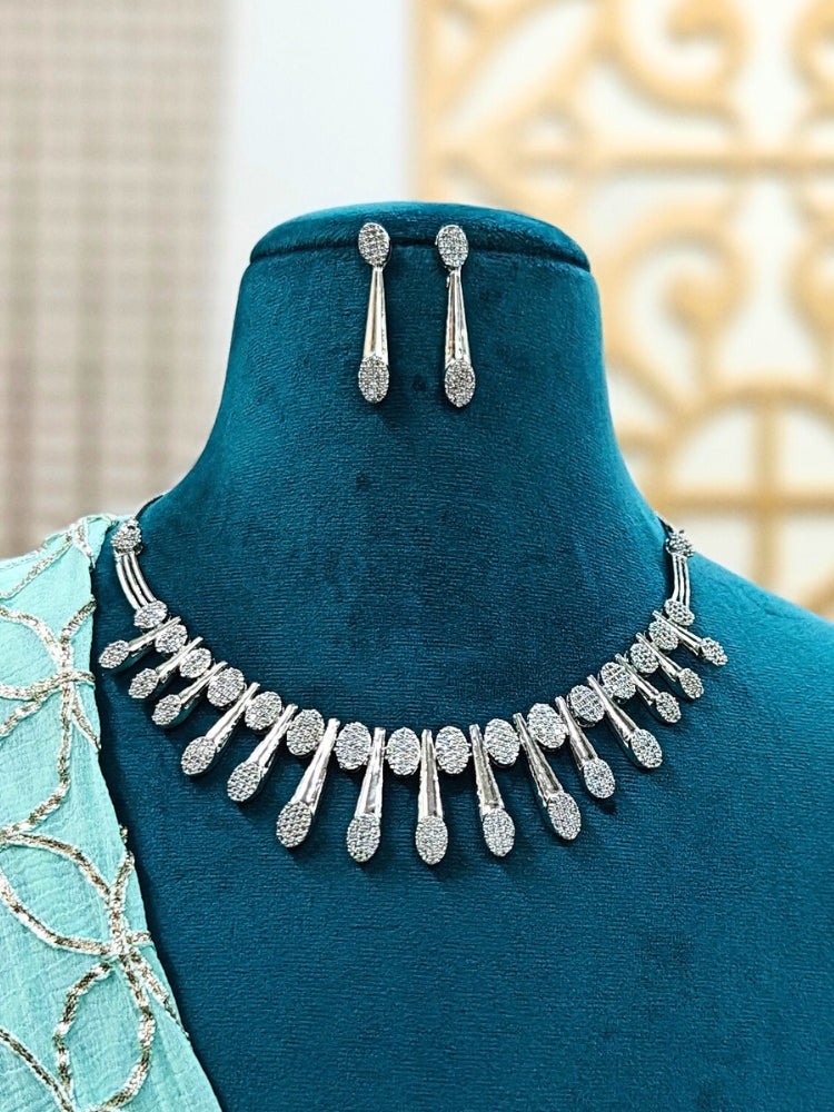 Close-up of a model in luxurious artificial diamond jewelry featuring a designer diamond necklace and earrings set, crafted for bridal fashion and high-end weddings. This beautiful diamond jewelry set offers the brilliance of real diamonds at an affordable price.