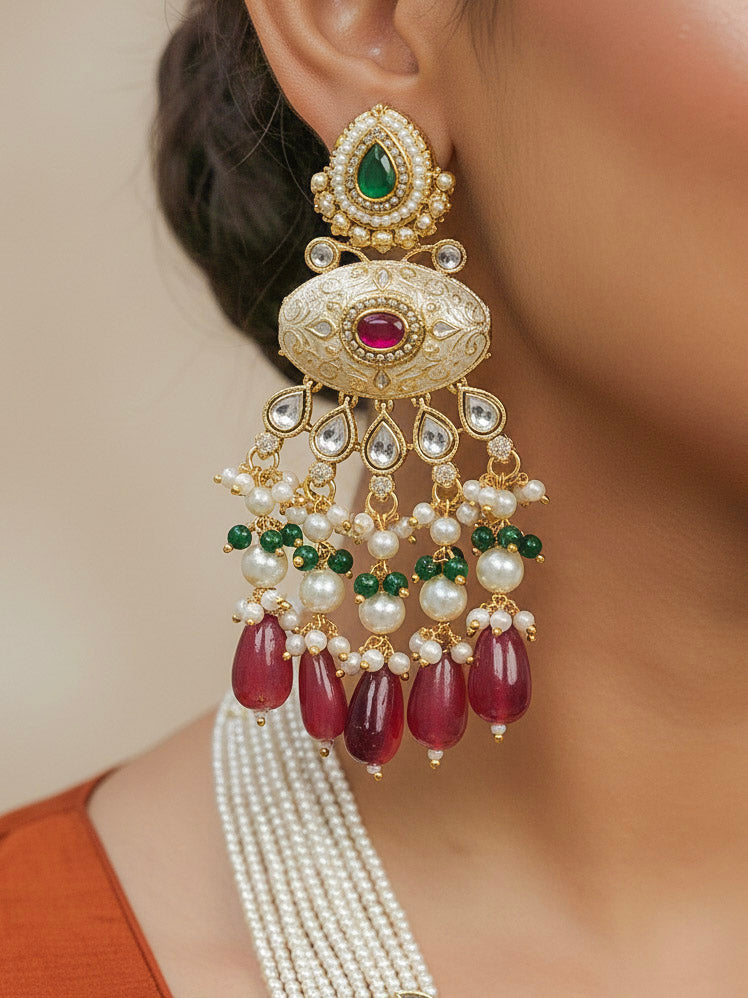 Close-up of a woman wearing an ornate traditional Ruby Pink and Green Rajwadi gold Long jewellery set and earrings  with Pearls, Beads, Meenakari and Moissanite Kundan. Woman styled in a royal Rajwadi artificial necklace set for a traditional Indian festives. Woman pairing a Rajwadi necklace with a Anarkali.