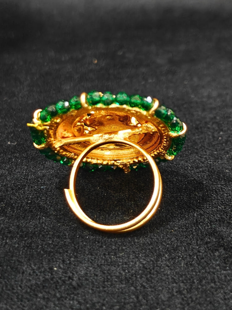 The Siddhi Ring featuring a traditional gold Ring with Goddess Laxmi in the middle, along with Green Crystal Beads, Bride showcasing a premium temple artificial Ring for wedding rituals. 