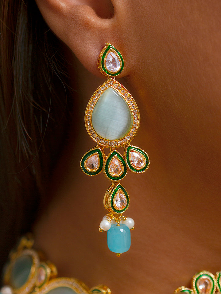Close-up of a women wearing an ornate traditional Sky Blue Choker jewellery set and earrings and maangtikka with Kundan, Monalisa Stone, American Diamonds, Beads and Reverse American Diamonds and tumble stones. A graceful woman wearing a trending Colored Stone necklace for a 2026 wedding celebration. Elegant wedding jewelry look featuring a premium artificial Colored Stone necklace.