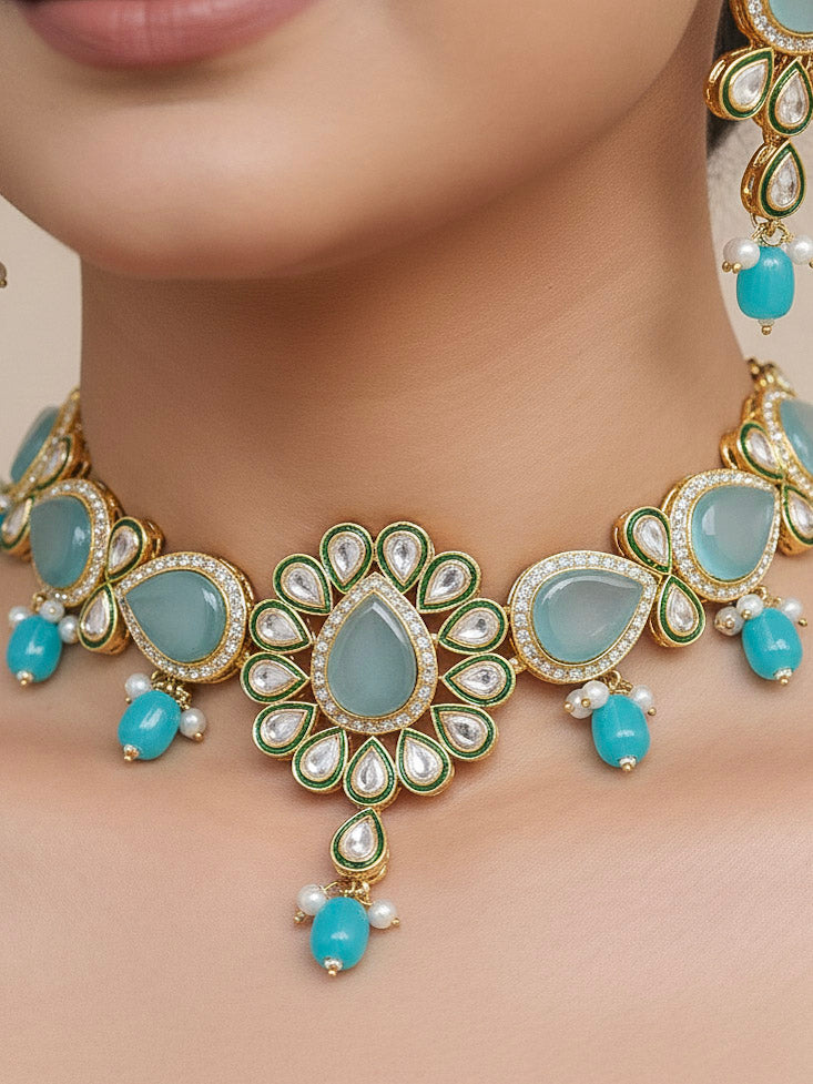 Close-up of a woman wearing an ornate traditional Sky Blue Choker jewellery set and earrings and maangtikka with Kundan, Monalisa Stone, American Diamonds, Beads and Reverse American Diamonds and tumble stones. A graceful woman wearing a trending Colored Stone necklace for a 2026 wedding celebration. Elegant wedding jewelry look featuring a premium artificial Colored Stone necklace.