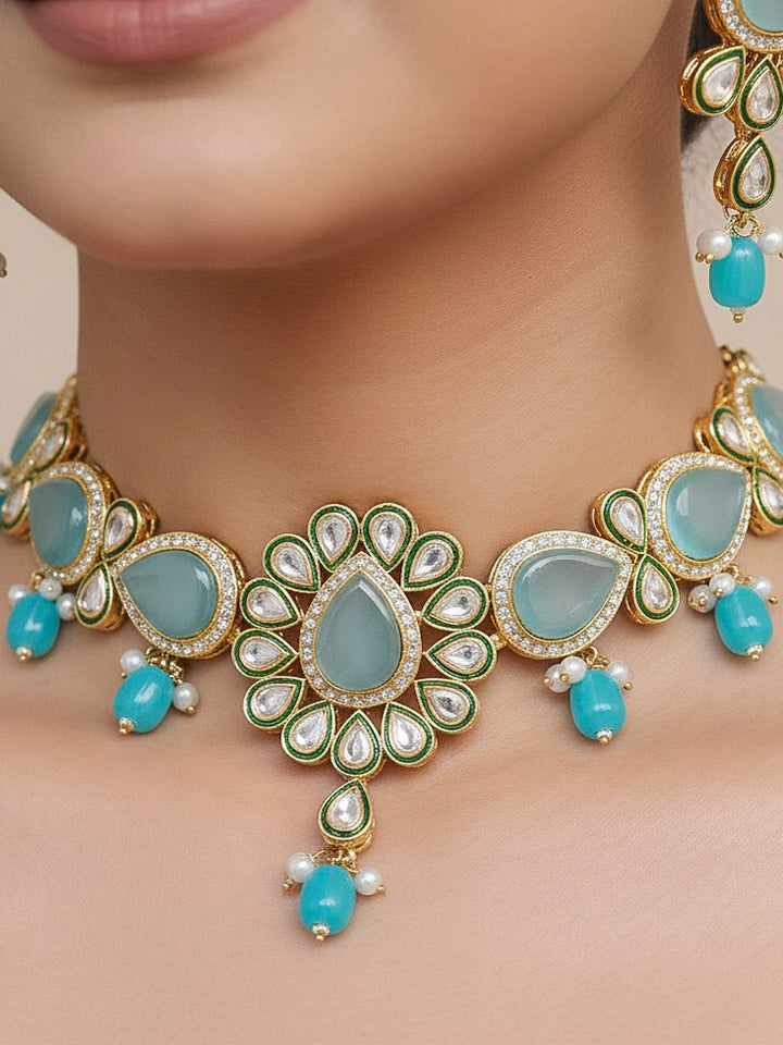 Close-up of a woman wearing an ornate traditional Sky Blue Choker jewellery set and earrings and maangtikka with Kundan, Monalisa Stone, American Diamonds, Beads and Reverse American Diamonds and tumble stones. A graceful woman wearing a trending Colored Stone necklace for a 2026 wedding celebration. Elegant wedding jewelry look featuring a premium artificial Colored Stone necklace.