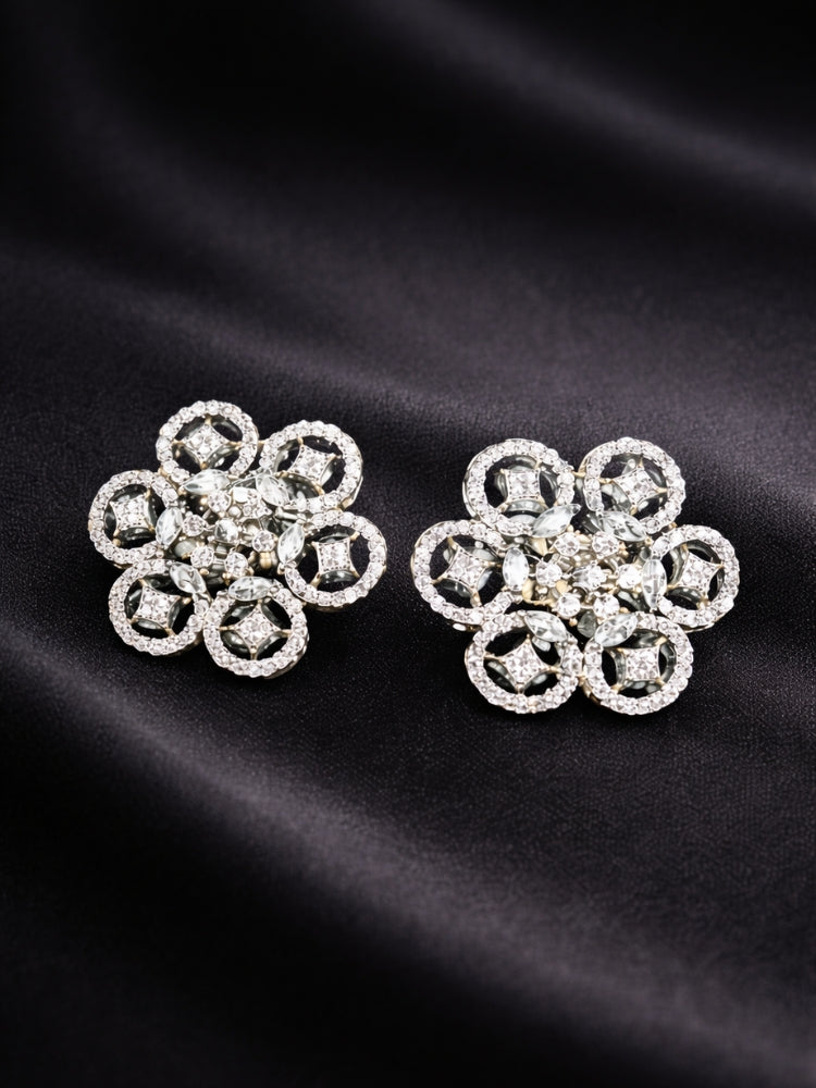 Close-up of an ornate Western (Silver Polish) Diamond Studs Earrings with American Diamond. Festive Diwali outfit styled with an American diamond artificial Earrings. Close-up shot of a high-quality American diamond artificial Earrings worn for festive celebrations.
