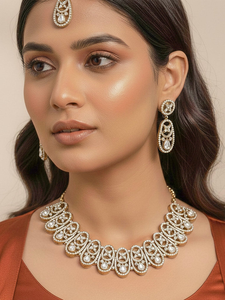"A close-up shot of a bride wearing a stunning artificial diamond necklace with matching earrings and maangtikka, designed to complement bridal attire. This affordable diamond necklace set is perfect for brides seeking luxurious but cost-effective wedding jewelry in India."
