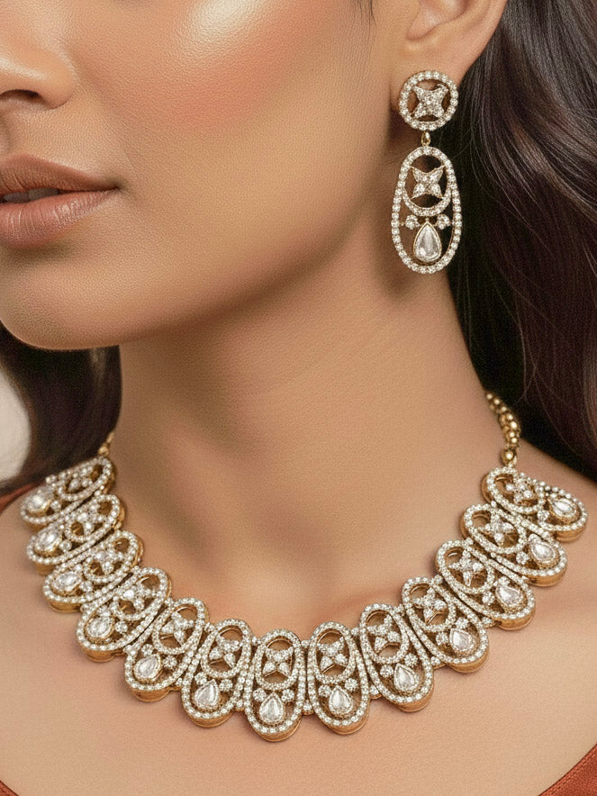 "A bride-to-be wearing an exquisite artificial diamond necklace and matching earrings and maangtikka, designed for the perfect engagement look. This stunning artificial diamond jewelry set offers luxury and sophistication while being an affordable alternative to natural diamonds."
