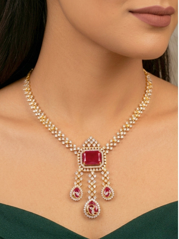 Close-up of a woman wearing an ornate Western (Gold Polish) Collar jewellery set and earrings with American Diamond and Colored Stones. Party wear outfit completed with a lightweight American diamond necklace. Elegant wedding jewelry look featuring a premium artificial American diamond necklace.