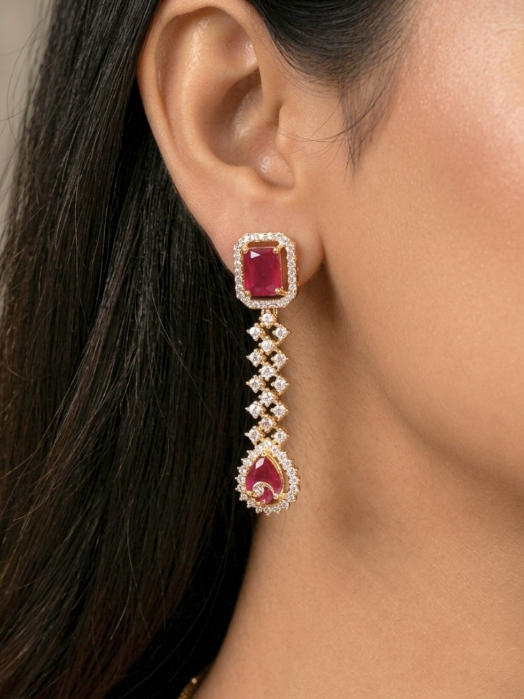 Close-up of a woman wearing an ornate Western (Gold Polish) Collar jewellery set and earrings with American Diamond and Colored Stones. Party wear outfit completed with a lightweight American diamond necklace. Elegant wedding jewelry look featuring a premium artificial American diamond necklace.