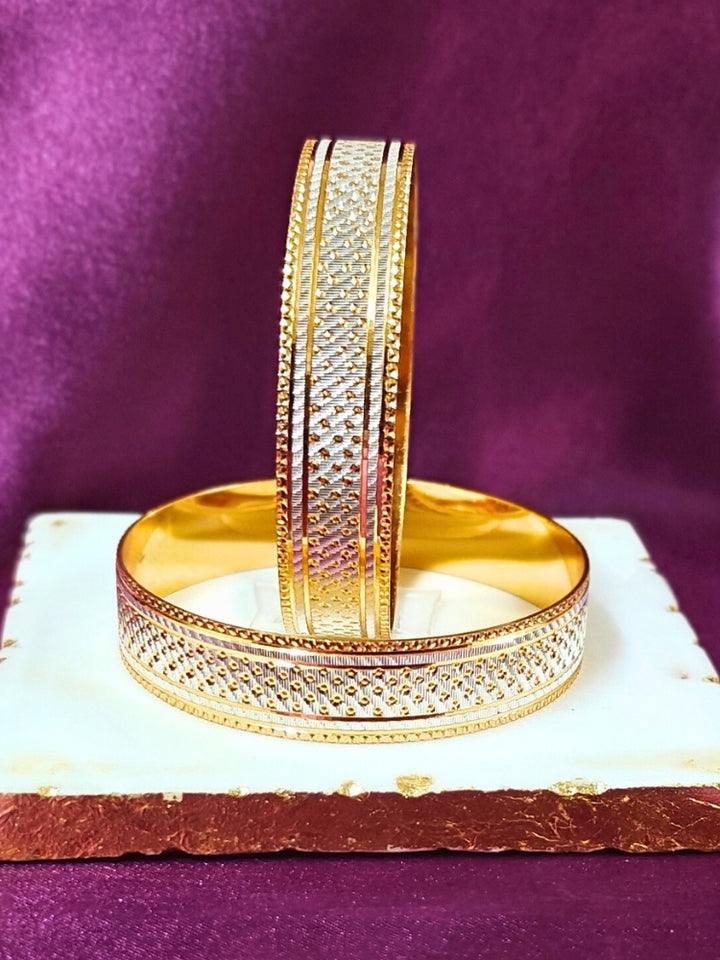 Close-up of an ornate traditional (Gold Polish) White Bangles Set. It’s comfortable and lightweight enough for everyday wear, and it also looks absolutely beautiful and elegant. The design is stylish, the finish is impressive, and it feels really pleasant to wear all day.