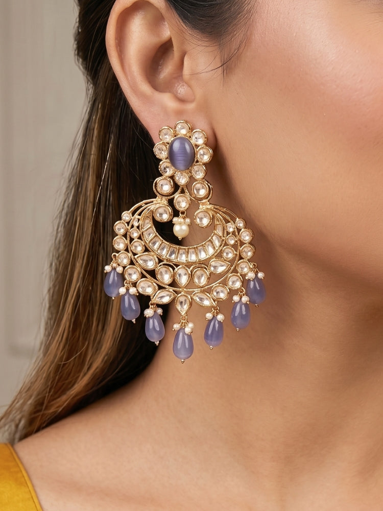 Close-up of a woman wearing an ornate traditional (Gold Polish) Lilac Long jewellery set and earrings with Polki,  Tumble Beads, Crystal Beads, Pearls and Colored Stone. Woman styling a premium Polki imitation necklace for wedding celebrations. Wedding guest outfit styled with an elegant Polki necklace set.