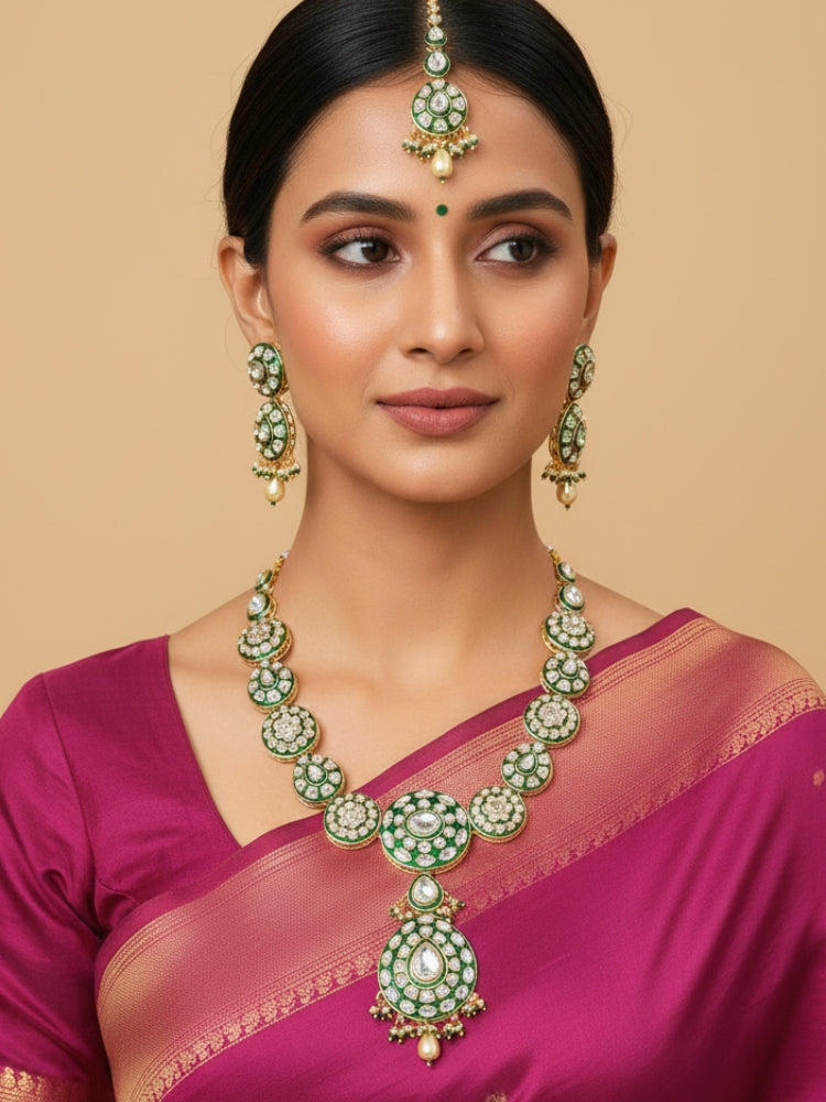 Close-up of a woman wearing an ornate traditional Green Jewelry Set, Earrings and Mangtikka with Kundan. Bride wearing a traditional Kundan artificial necklace set for her wedding ceremony. Woman wearing trending Kundan artificial jewelry for wedding season in India.
