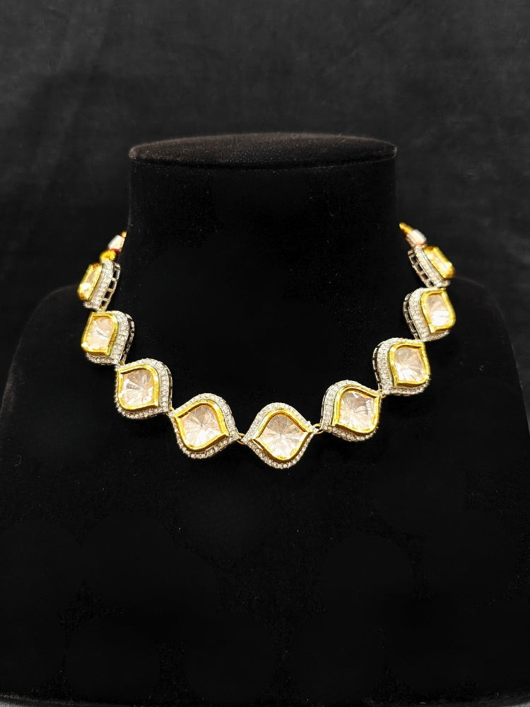 The Moissanite Susan Necklace Set—gold and silver Kundan necklace surrounded by American Diamonds, with matching earrings—gazing neutrally at the camera, effortlessly highlighting this luxury jewelry. Woman wearing trending Kundan artificial jewelry for wedding season in India. Festive saree styling with a premium artificial Kundan necklace.