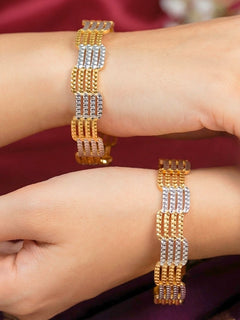 Close-up of an a women wearing ornate traditional (Gold Polish) Gold & Silver Bangles Set. It’s comfortable and lightweight enough for everyday wear, and it also looks absolutely beautiful and elegant. The design is stylish, the finish is impressive, and it feels really pleasant to wear all day.