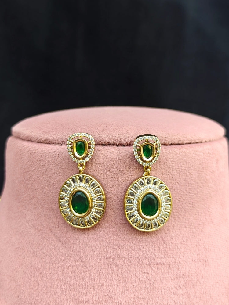 Close-up of an ornate Indo-western Dark Green (Dull gold) Hasli Diamond jewellery set and earrings with American Diamond and Colored Stones. Wedding guest wearing a sparkling American diamond necklace with a saree.
Close-up shot of a high-quality American diamond artificial necklace worn for festive celebrations.