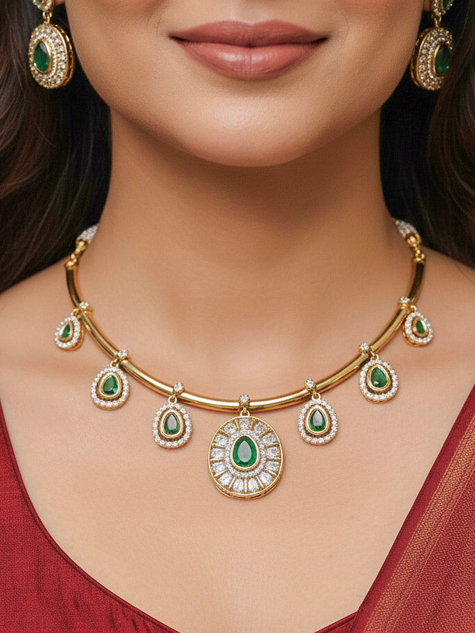 Close-up of a woman wearing an ornate Indo-western Dark Green (Dull gold) Hasli Diamond jewellery set and earrings with American Diamond and Colored Stones. Wedding guest wearing a sparkling American diamond necklace with a saree.
Close-up shot of a high-quality American diamond artificial necklace worn for festive celebrations.