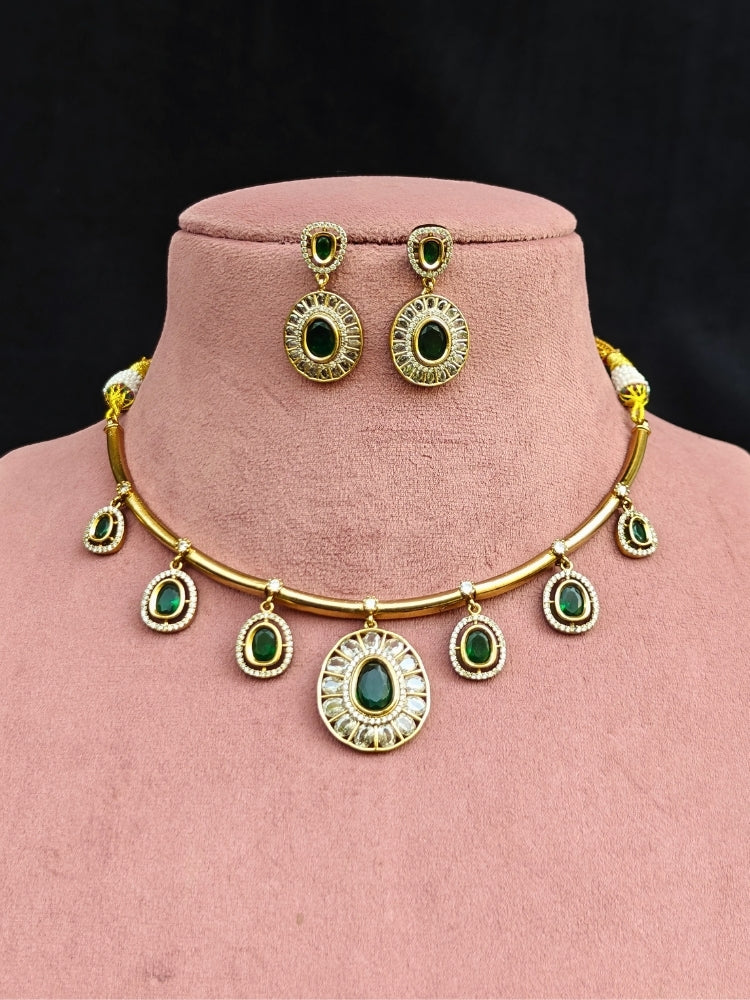 Close-up of an ornate Indo-western Dark Green (Dull gold) Hasli Diamond jewellery set and earrings with American Diamond and Colored Stones. Wedding guest wearing a sparkling American diamond necklace with a saree.
Close-up shot of a high-quality American diamond artificial necklace worn for festive celebrations.