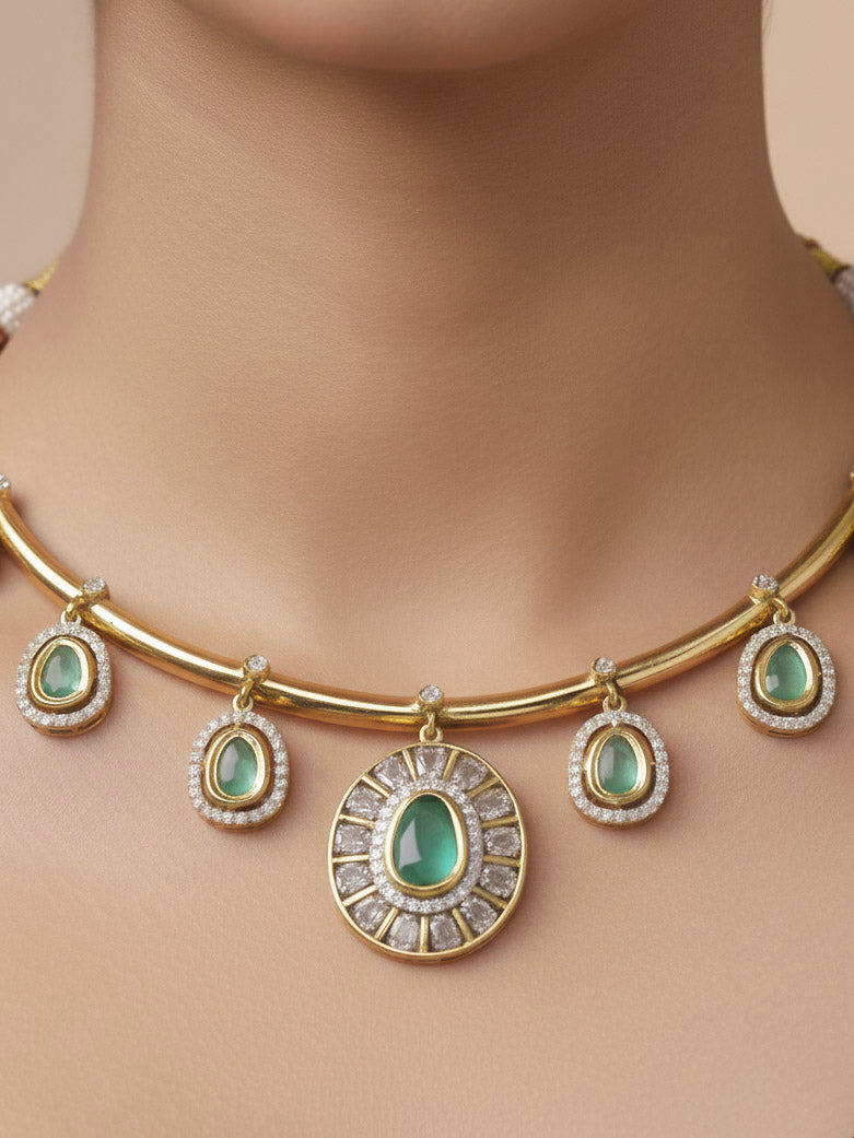 Close-up of a woman wearing an ornate Indo-western Mint Green (Dull gold) Hasli Diamond jewellery set and earrings with American Diamond and Colored Stones. Wedding guest wearing a sparkling American diamond necklace with a saree.
Close-up shot of a high-quality American diamond artificial necklace worn for festive celebrations.