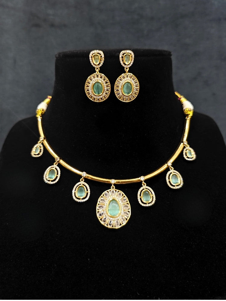 Close-up of an ornate Indo-western Mint Green (Dull gold) Hasli Diamond jewellery set and earrings with American Diamond and Colored Stones. Wedding guest wearing a sparkling American diamond necklace with a saree.
Close-up shot of a high-quality American diamond artificial necklace worn for festive celebrations.