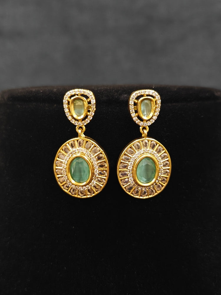 Close-up of an ornate Indo-western Mint Green (Dull gold) Hasli Diamond jewellery set and earrings with American Diamond and Colored Stones. Wedding guest wearing a sparkling American diamond necklace with a saree.
Close-up shot of a high-quality American diamond artificial necklace worn for festive celebrations.