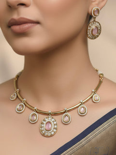 Close-up of a woman wearing an ornate Indo-western Mint Pink (Dull gold) Hasli Diamond jewellery set and earrings with American Diamond and Colored Stones. Wedding guest wearing a sparkling American diamond necklace with a saree.
Close-up shot of a high-quality American diamond artificial necklace worn for festive celebrations.