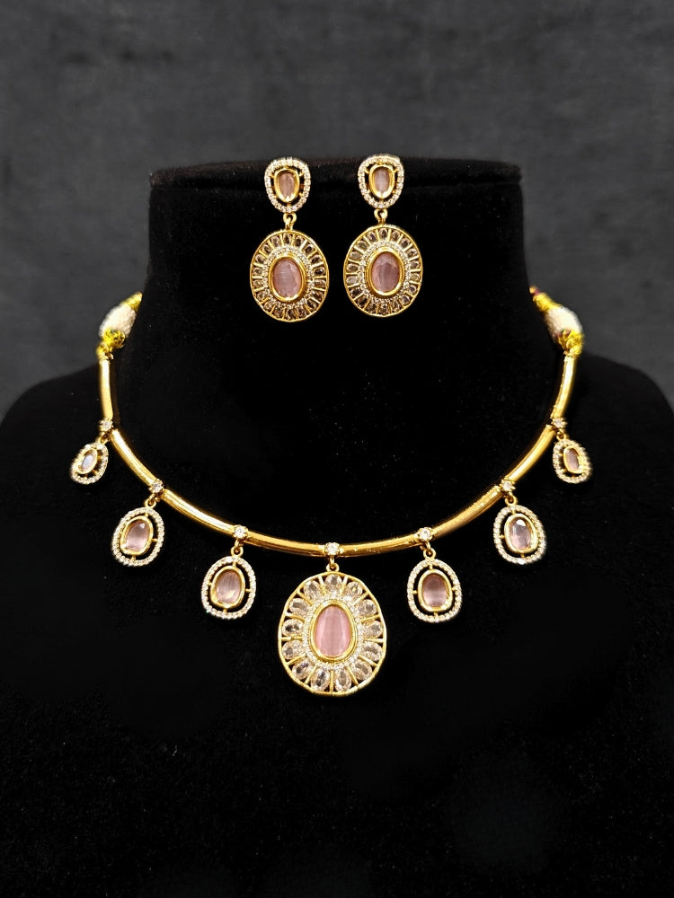 Close-up of an ornate Indo-western Mint Pink (Dull gold) Hasli Diamond jewellery set and earrings with American Diamond and Colored Stones. Wedding guest wearing a sparkling American diamond necklace with a saree.
Close-up shot of a high-quality American diamond artificial necklace worn for festive celebrations.