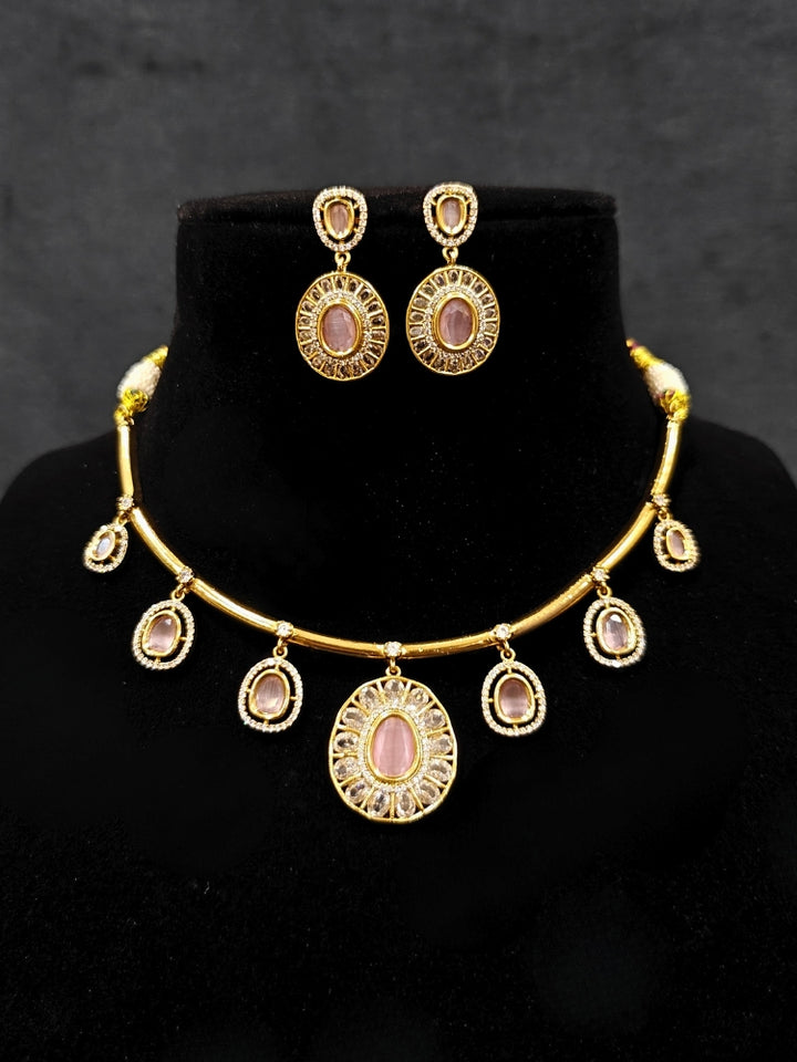 Close-up of an ornate Indo-western Mint Pink (Dull gold) Hasli Diamond jewellery set and earrings with American Diamond and Colored Stones. Wedding guest wearing a sparkling American diamond necklace with a saree.
Close-up shot of a high-quality American diamond artificial necklace worn for festive celebrations.