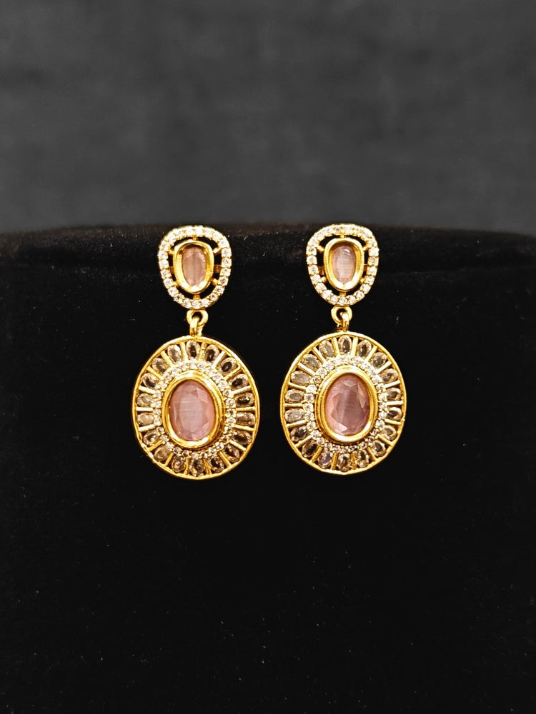 Close-up of an ornate Indo-western Mint Pink (Dull gold) Hasli Diamond jewellery set and earrings with American Diamond and Colored Stones. Wedding guest wearing a sparkling American diamond necklace with a saree.
Close-up shot of a high-quality American diamond artificial necklace worn for festive celebrations.