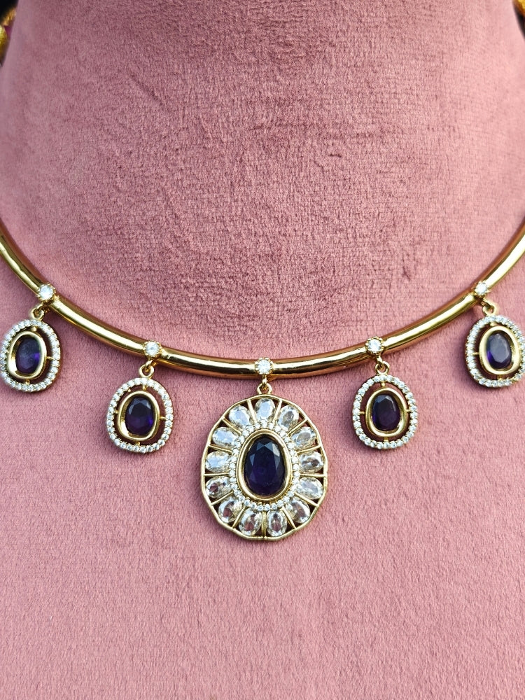 Close-up of an ornate Indo-western Purple (Dull gold) Hasli Diamond jewellery set and earrings with American Diamond and Colored Stones. Wedding guest wearing a sparkling American diamond necklace with a saree.
Close-up shot of a high-quality American diamond artificial necklace worn for festive celebrations.