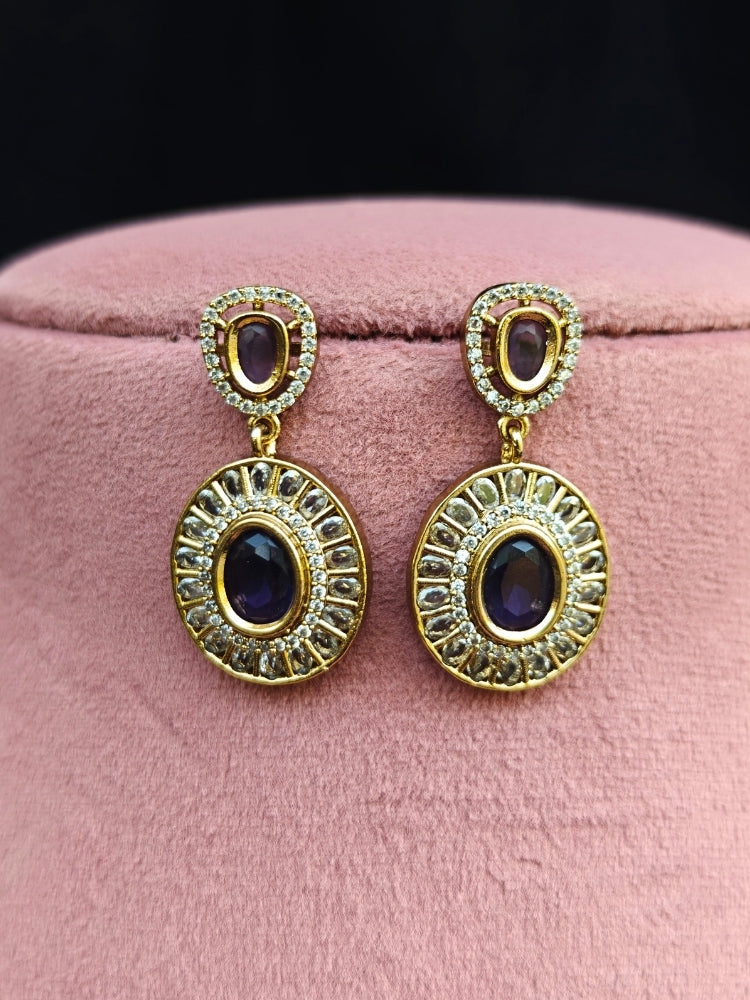 Close-up of an ornate Indo-western Purple (Dull gold) Hasli Diamond jewellery set and earrings with American Diamond and Colored Stones. Wedding guest wearing a sparkling American diamond necklace with a saree.
Close-up shot of a high-quality American diamond artificial necklace worn for festive celebrations.