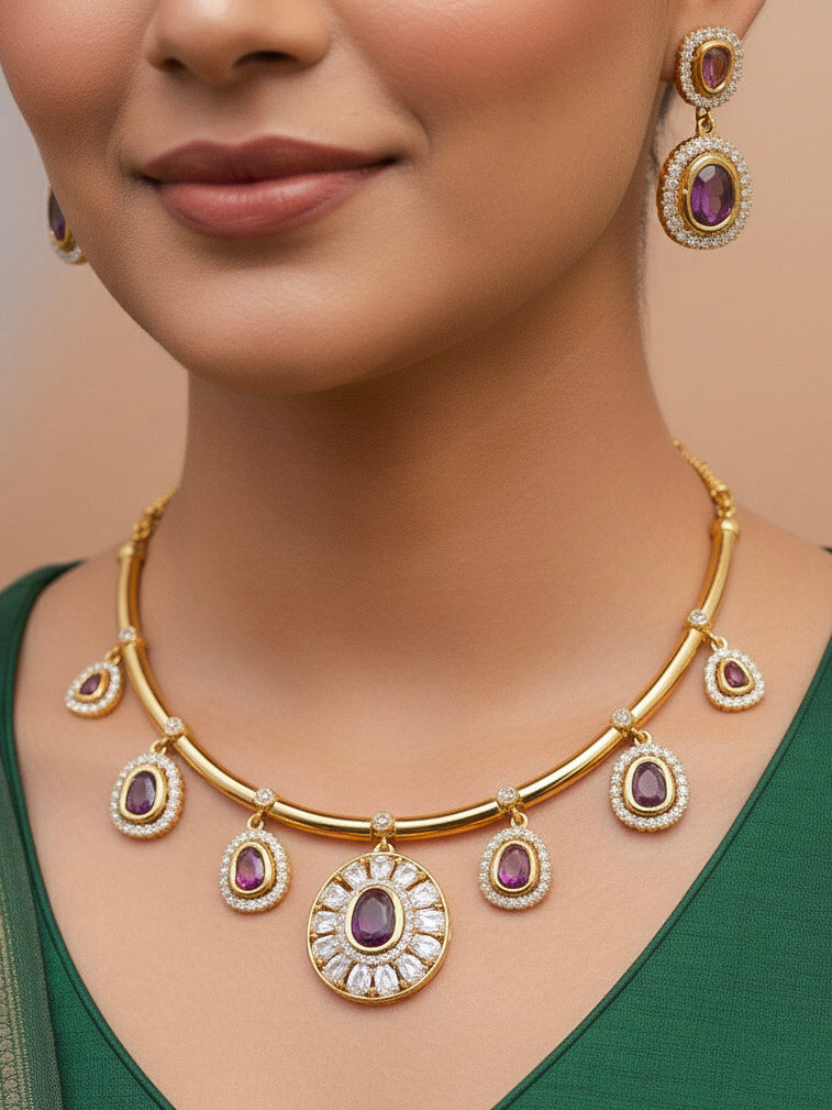 Close-up of a woman wearing an ornate Indo-western Purple (Dull gold) Hasli Diamond jewellery set and earrings with American Diamond and Colored Stones. Wedding guest wearing a sparkling American diamond necklace with a saree.
Close-up shot of a high-quality American diamond artificial necklace worn for festive celebrations.